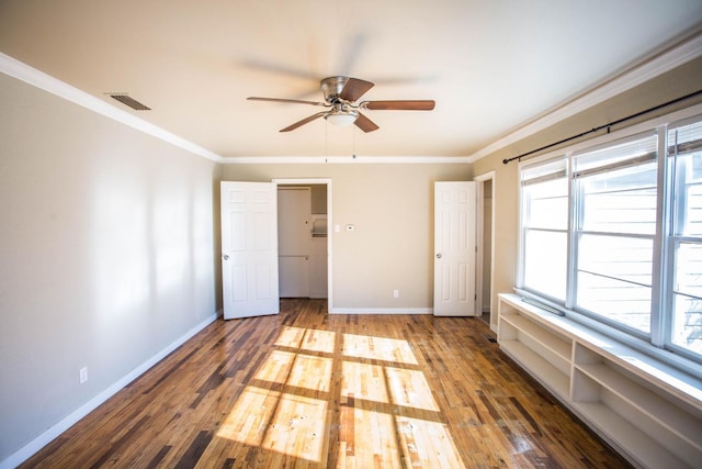 unfurnished bedroom featuring hardwood / wood-style flooring, ceiling fan, and ornamental molding