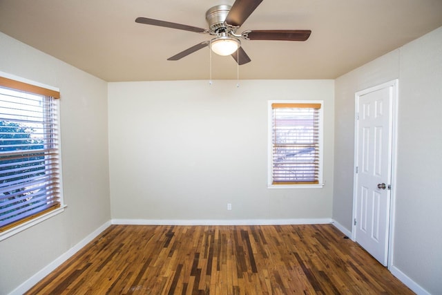 unfurnished room with dark hardwood / wood-style flooring, plenty of natural light, and ceiling fan