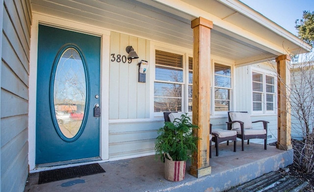 view of exterior entry featuring a porch