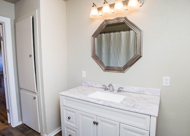 bathroom featuring vanity and hardwood / wood-style flooring