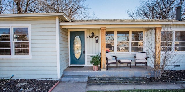 property entrance featuring a porch