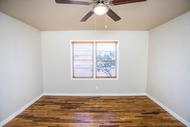 empty room with dark hardwood / wood-style floors