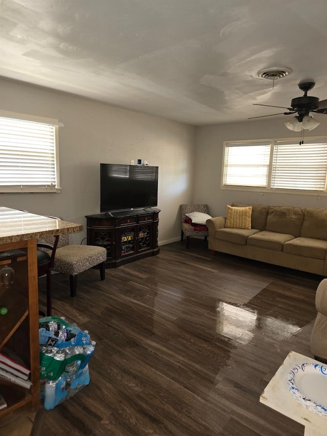 living room with dark hardwood / wood-style floors and ceiling fan