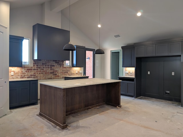 kitchen with visible vents, a kitchen island, high vaulted ceiling, and unfinished concrete flooring