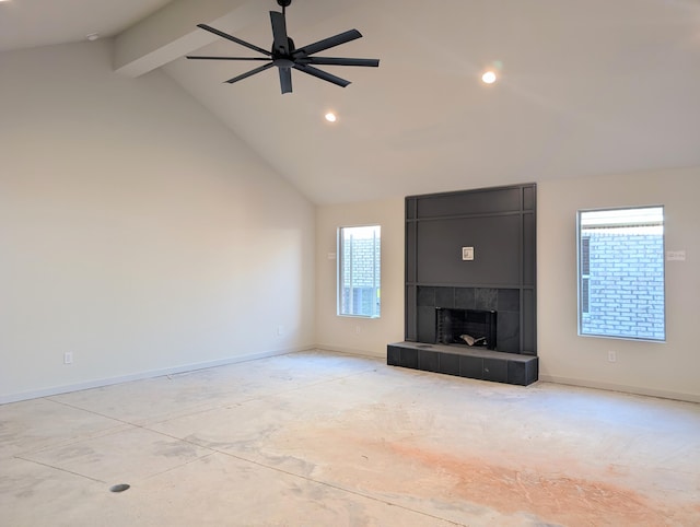 unfurnished living room featuring high vaulted ceiling, beam ceiling, baseboards, and a tiled fireplace