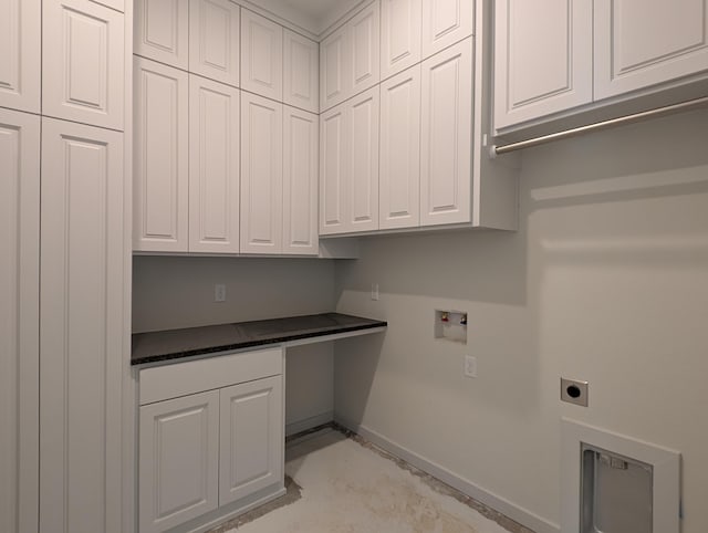 washroom with washer hookup, cabinet space, baseboards, and electric dryer hookup