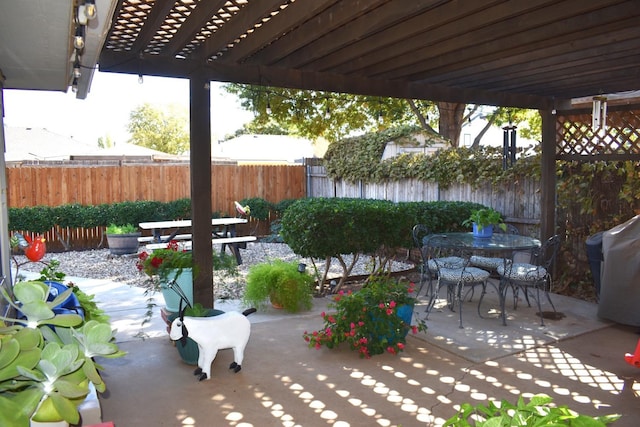 view of patio featuring outdoor dining area, a grill, fence, and a pergola