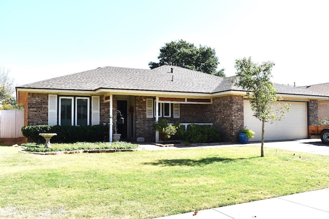 ranch-style home with a garage and a front lawn