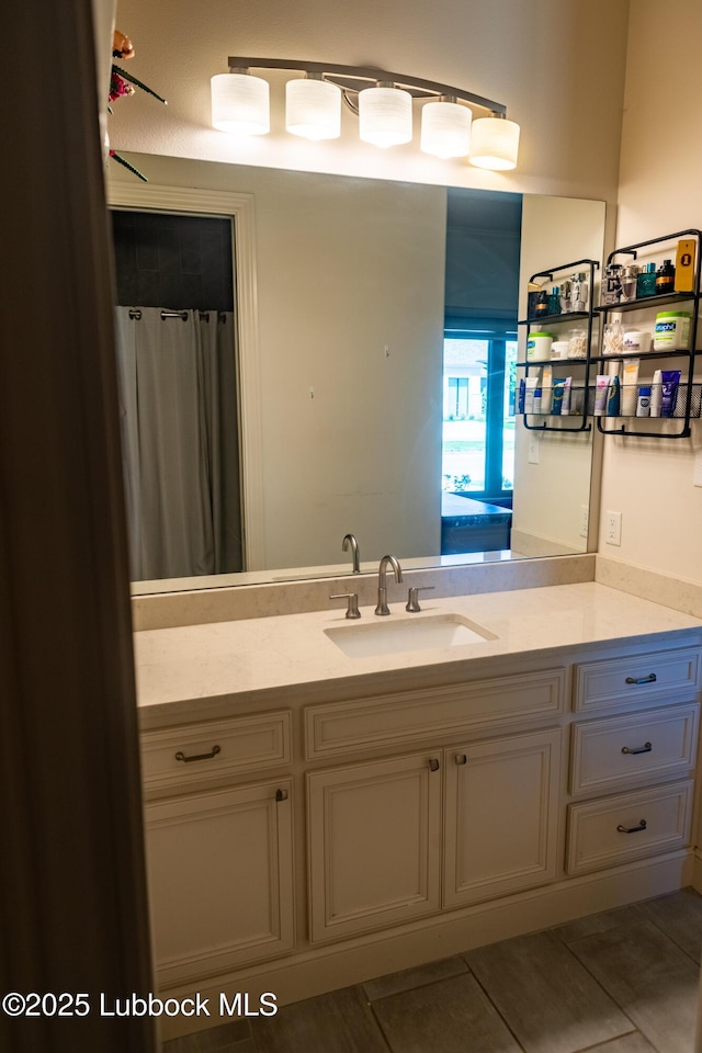 11707 Uxbridge Ave, Lubbock, TX 79424 - full bathroom with vanity and tile patterned floors