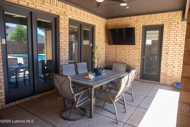 11707 Uxbridge Ave, Lubbock, TX 79424 - view of patio / terrace featuring french doors, a ceiling fan, and outdoor dining area