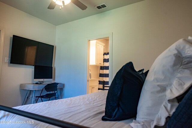 11707 Uxbridge Ave, Lubbock, TX 79424 - bedroom with ceiling fan and connected bathroom