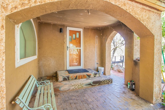 doorway to property with stucco siding