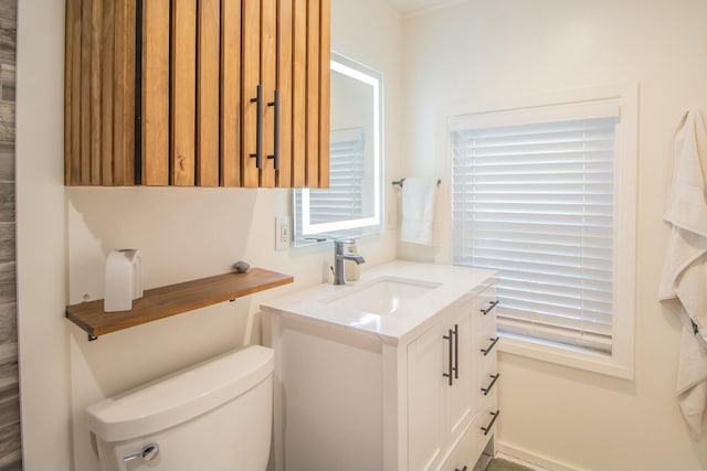half bathroom featuring toilet and vanity