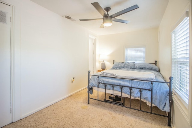 bedroom featuring visible vents, baseboards, and ceiling fan