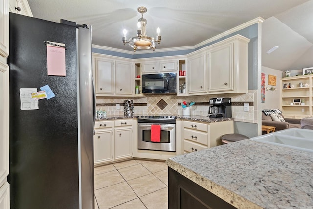 kitchen featuring pendant lighting, appliances with stainless steel finishes, backsplash, and light tile patterned floors