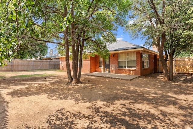 back of property with a patio area