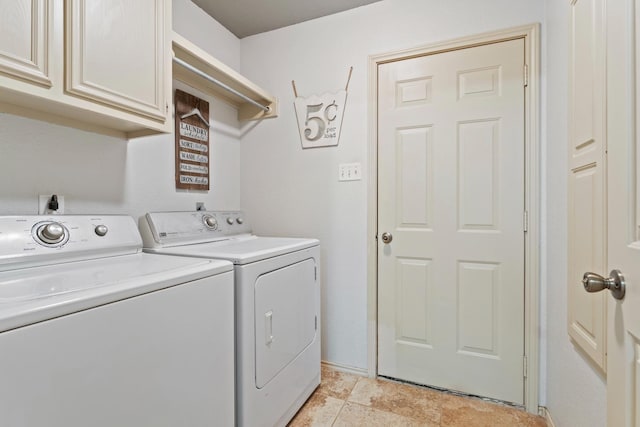 washroom with cabinets and independent washer and dryer