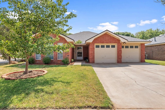 view of front of home featuring a garage and a front lawn