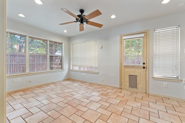 unfurnished room featuring ceiling fan