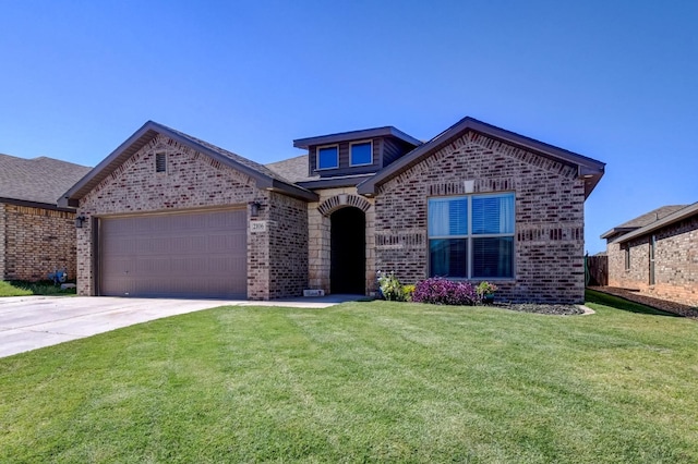 view of front of home with a garage and a front yard