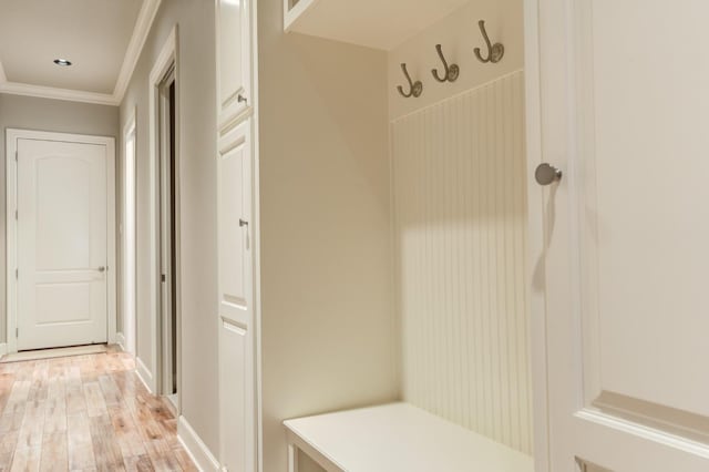 mudroom featuring light hardwood / wood-style flooring and ornamental molding