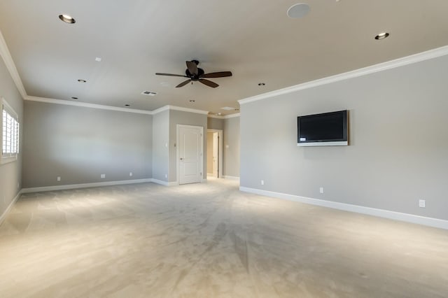 empty room with crown molding, light colored carpet, and ceiling fan