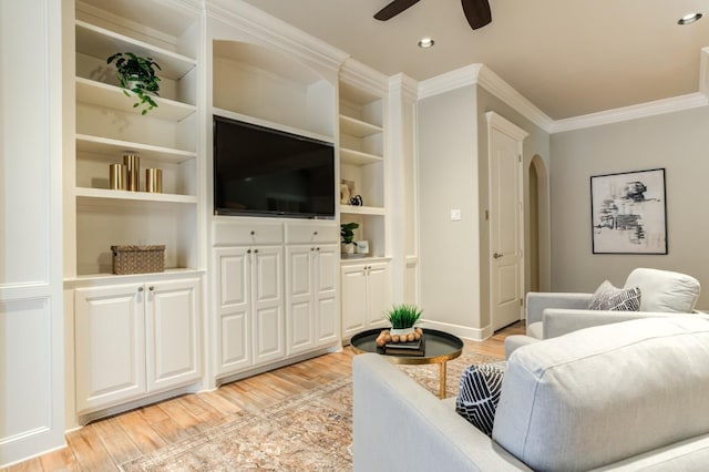 living room featuring ceiling fan, ornamental molding, and light hardwood / wood-style floors