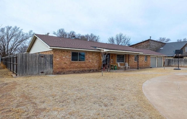 ranch-style home featuring a garage