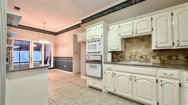 kitchen with white cabinets and white appliances