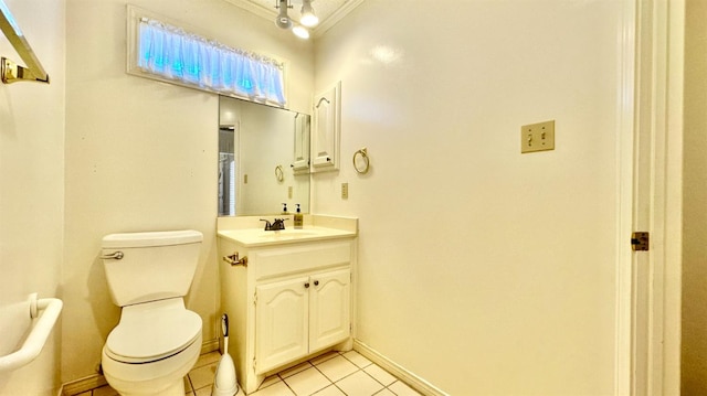 bathroom with vanity, ornamental molding, tile patterned floors, and toilet