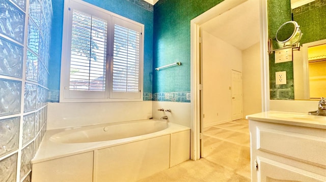 bathroom with vanity and a bathing tub