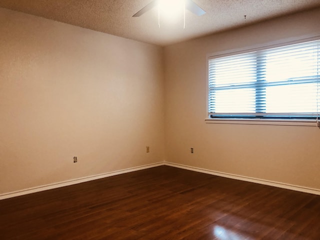 3423 94th St, Lubbock, TX 79423 - unfurnished room with wood finished floors, baseboards, ceiling fan, and a textured ceiling