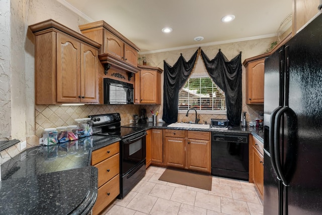 kitchen with sink, crown molding, dark stone countertops, decorative backsplash, and black appliances