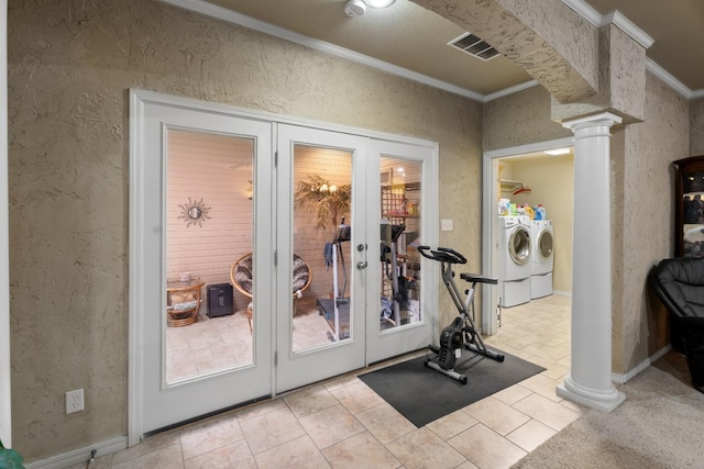 exercise room with french doors, crown molding, washer and dryer, and ornate columns