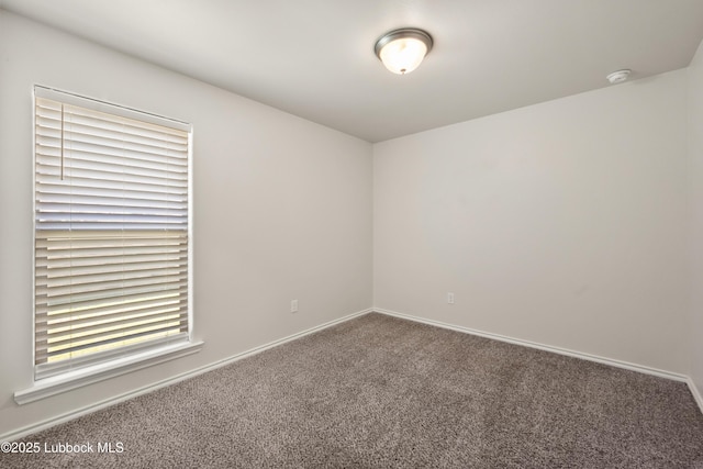 10303 Valencia Ave, Lubbock, TX 79424 - unfurnished room with carpet, a smoke detector, and baseboards