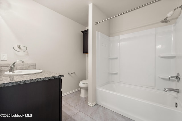 10303 Valencia Ave, Lubbock, TX 79424 - bathroom featuring toilet, tub / shower combination, tile patterned flooring, vanity, and baseboards