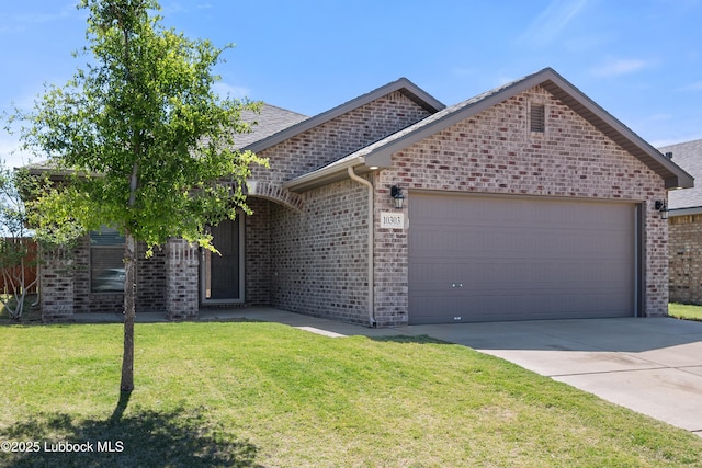 10303 Valencia Ave, Lubbock, TX 79424 - view of front of property featuring a garage, brick siding, driveway, and a front lawn