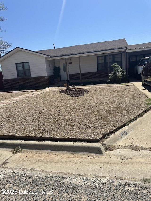 501 77th St, Lubbock, TX 79404 - view of front facade featuring brick siding