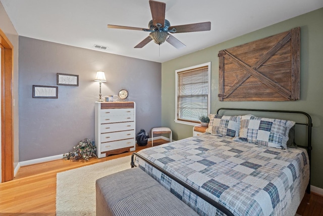 bedroom with hardwood / wood-style flooring and ceiling fan