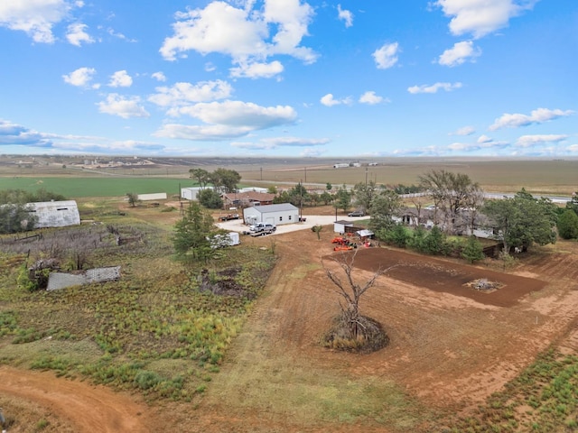 birds eye view of property with a rural view