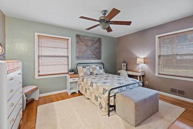 bedroom with hardwood / wood-style flooring and ceiling fan