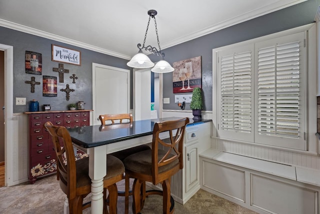 dining room featuring crown molding