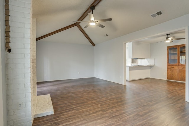 unfurnished living room featuring vaulted ceiling with beams, dark wood-type flooring, and ceiling fan