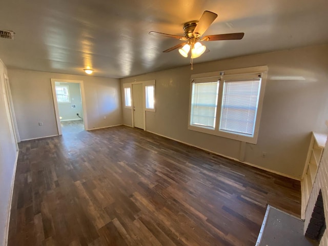 spare room featuring dark hardwood / wood-style floors and ceiling fan