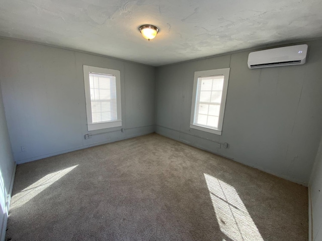 carpeted spare room with a wall mounted AC