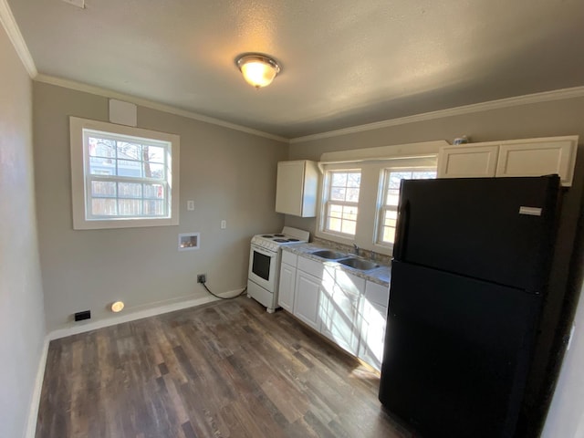 kitchen with sink, white cabinetry, white electric range oven, black fridge, and dark hardwood / wood-style flooring