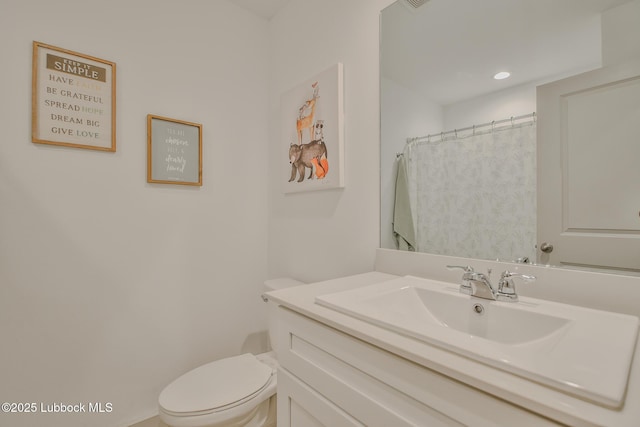 7406 9th St, Lubbock, TX 79416 - bathroom featuring toilet and vanity