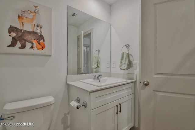 7406 9th St, Lubbock, TX 79416 - bathroom with vanity and toilet