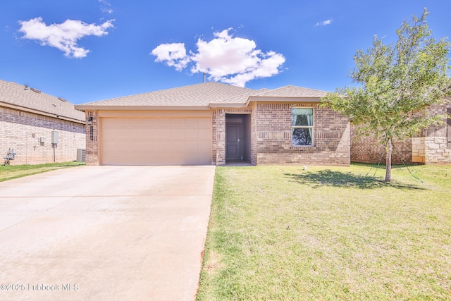 7406 9th St, Lubbock, TX 79416 - single story home featuring an attached garage, driveway, brick siding, and a front yard