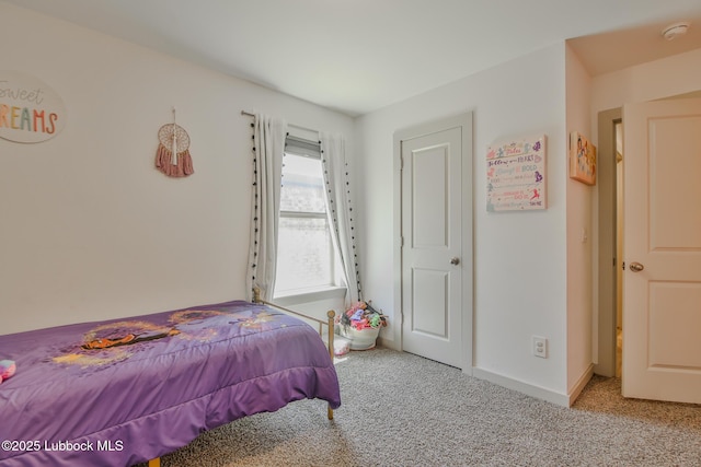 7406 9th St, Lubbock, TX 79416 - bedroom with carpet flooring and baseboards